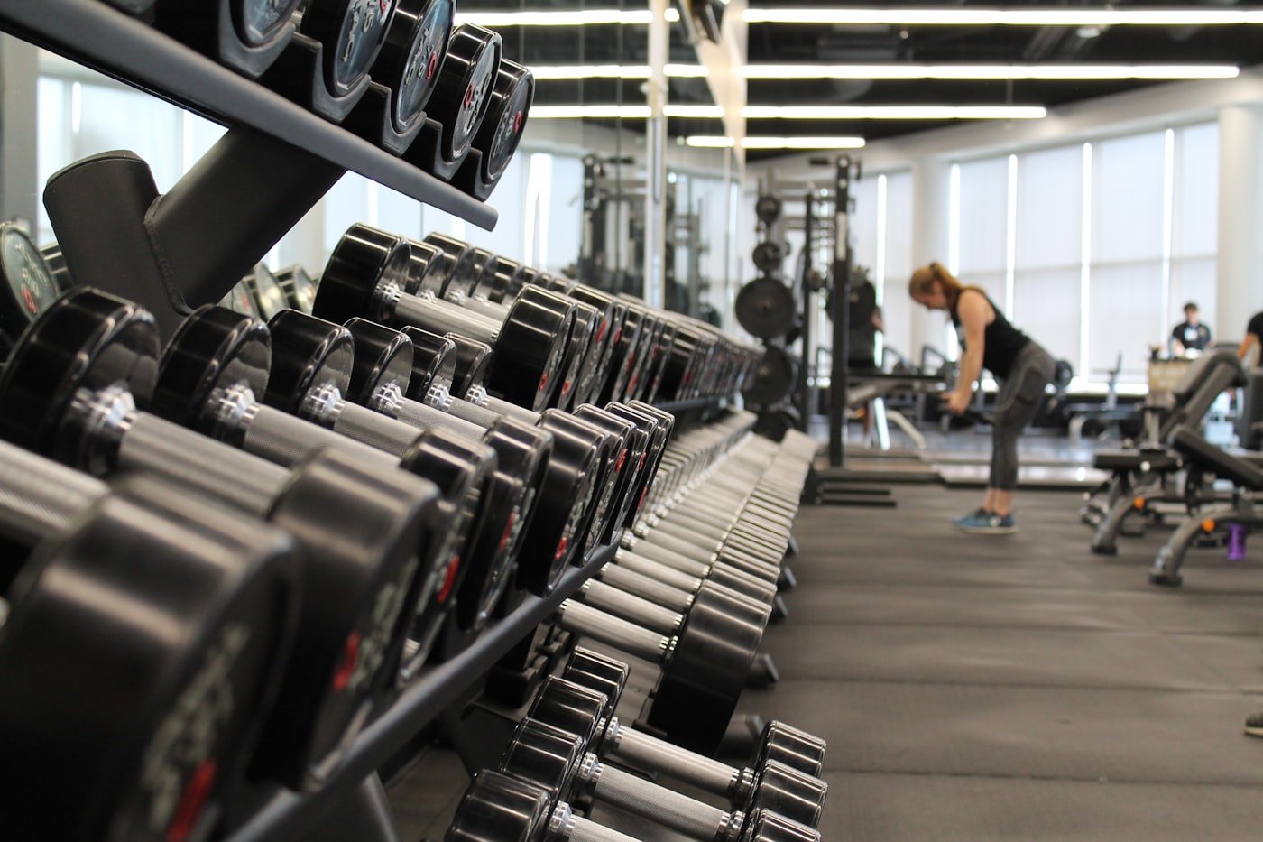 A full rack of dumbbells running the length of the gym floor.